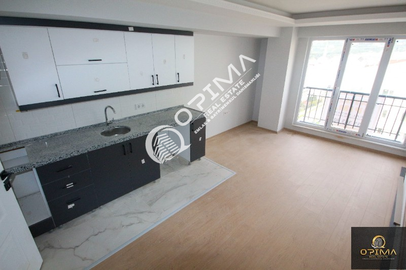 OPİMA EMLAKTAN ATAT&Uuml;RK MAHALLESİNDE YERDEN ISITMALI SIFIR YAŞINDA KİRALIK 1+1 DAİRE 